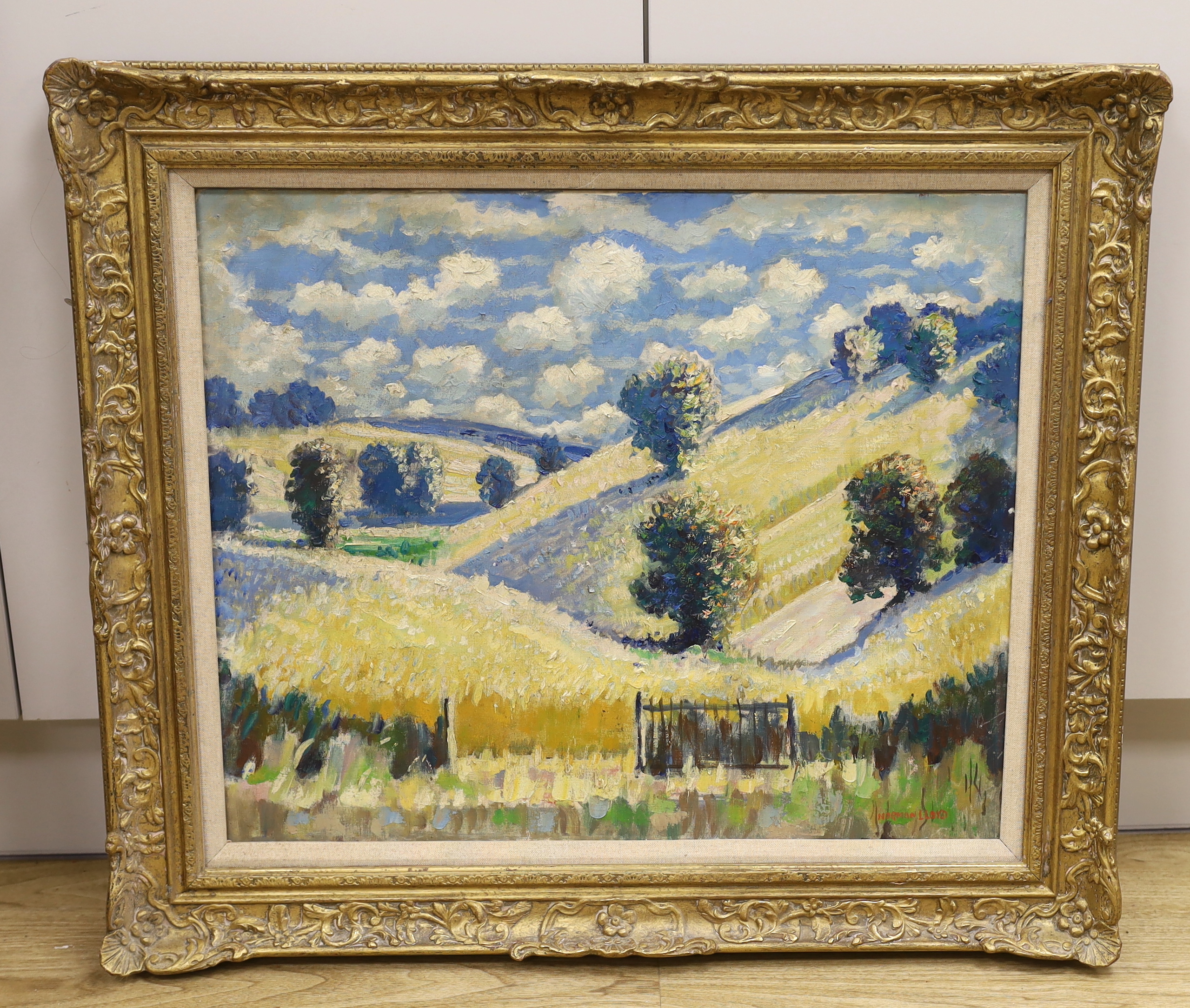 Norman Lloyd (Australian, 1897-1985), oil on canvas, Hillside landscape with trees, signed, 49 x 59cm